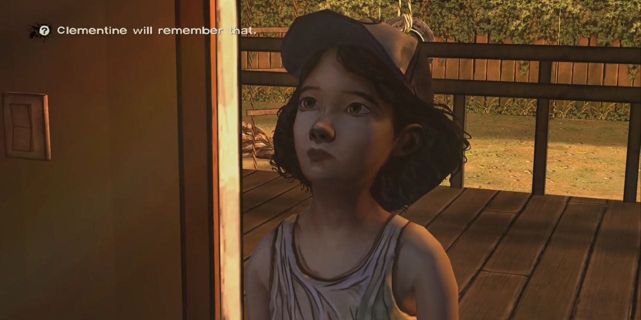 Clementine stands in her kitchen with "Clementine will remember that" appearing on the top left in Telltale's The Walking Dead