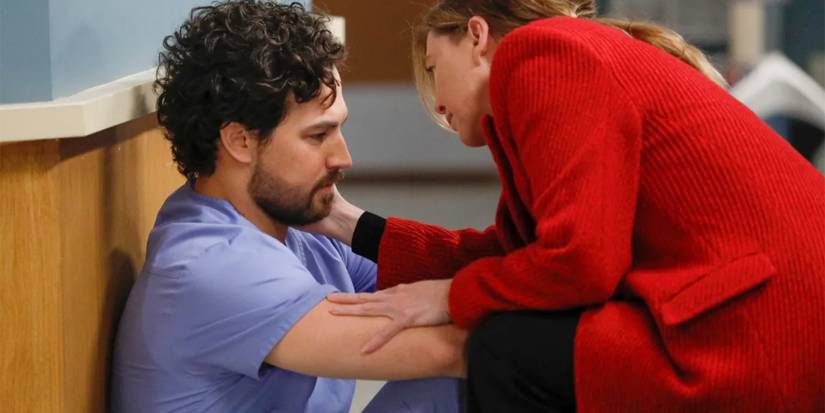 Meredith Grey (Ellen Pompeo) comforts a depressed Andrew DeLuca (Giacomo Gianniotti) in Grey's Anatomy.