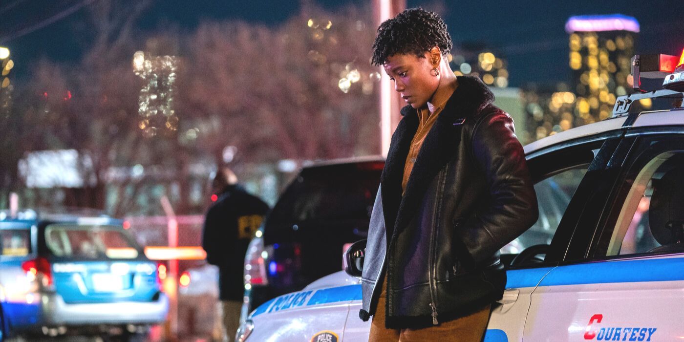 Tiffany Wallace (actor Katherine Renee Kane) looks down against NYPD squad car in FBI