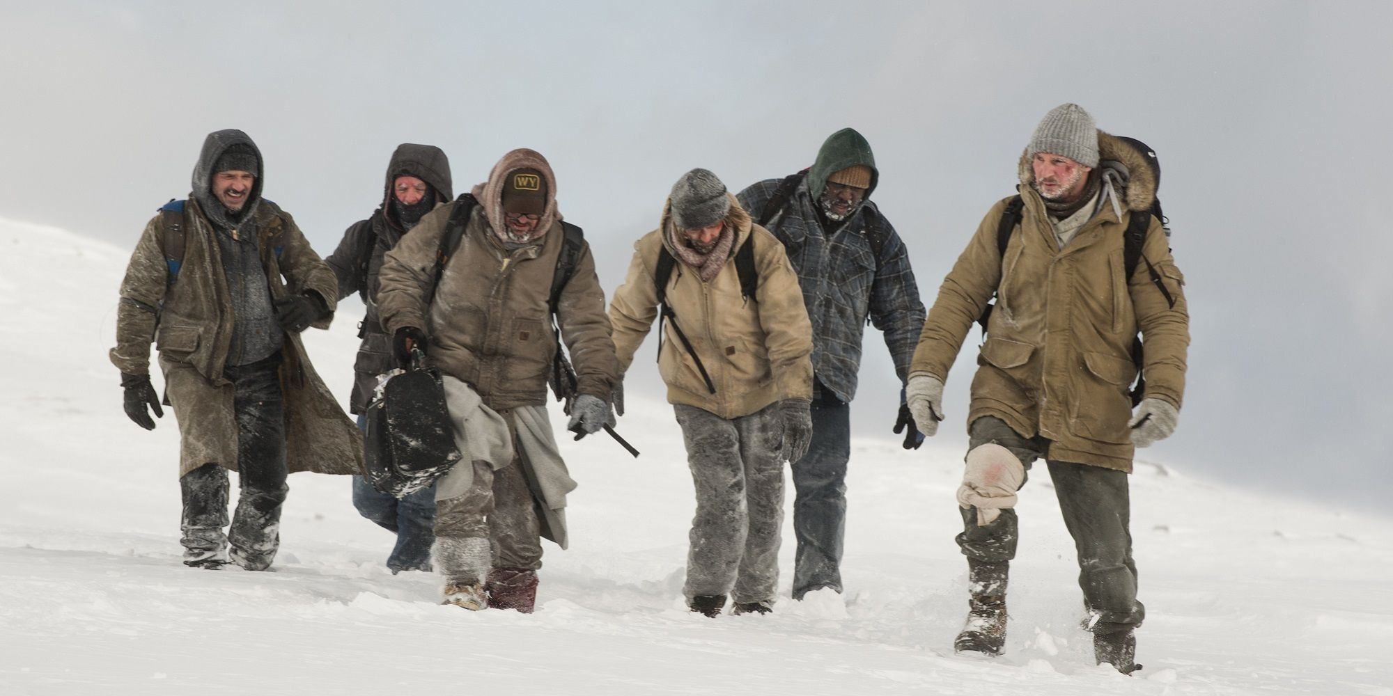 Liam Neeson with the plane crash survivors in The Grey-1