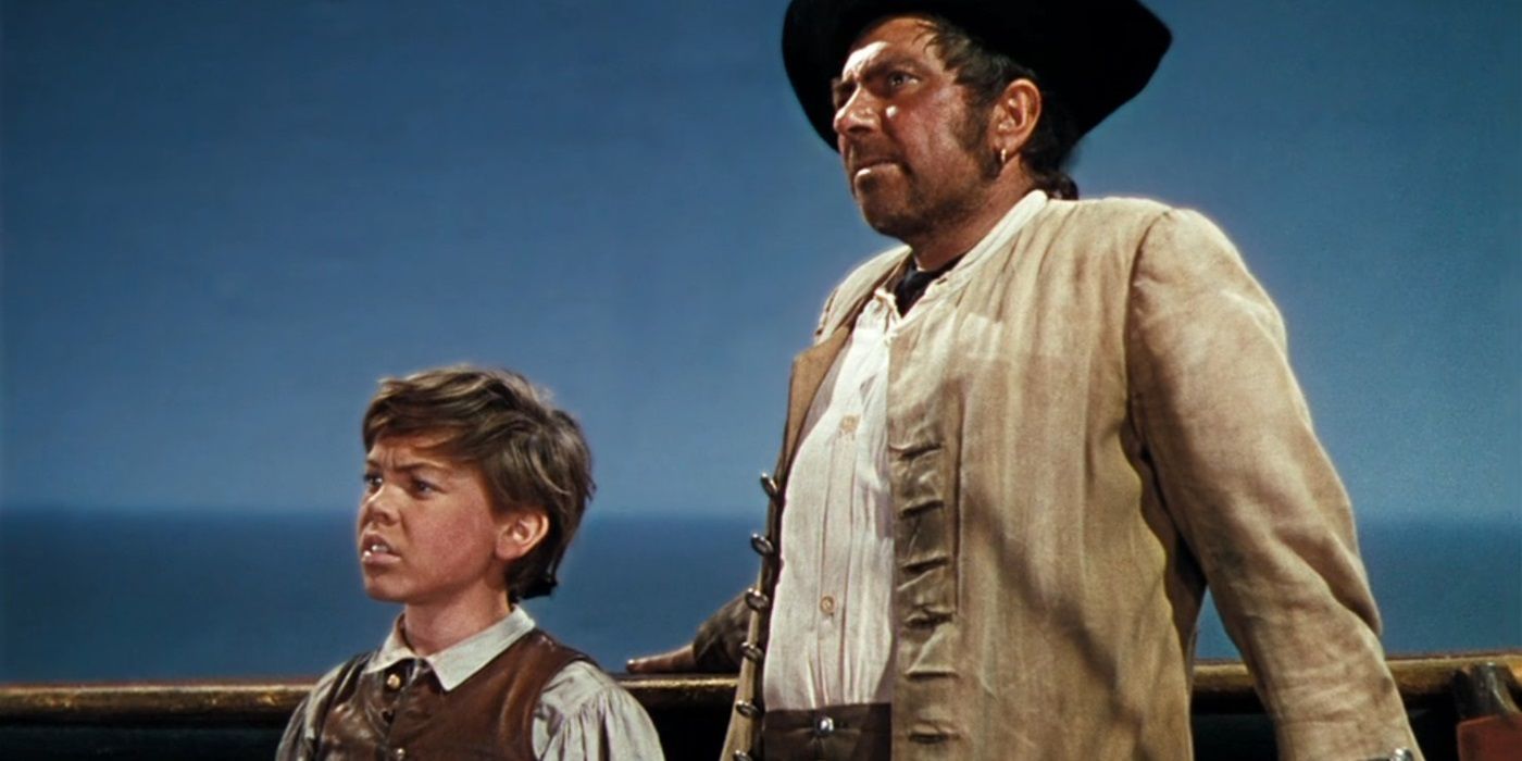 Long John Silver and Jim Hawkins look out at the sea in Disney's Treasure Island