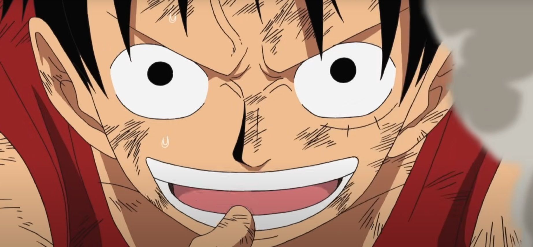 luffy holds his thumb up to his mouth