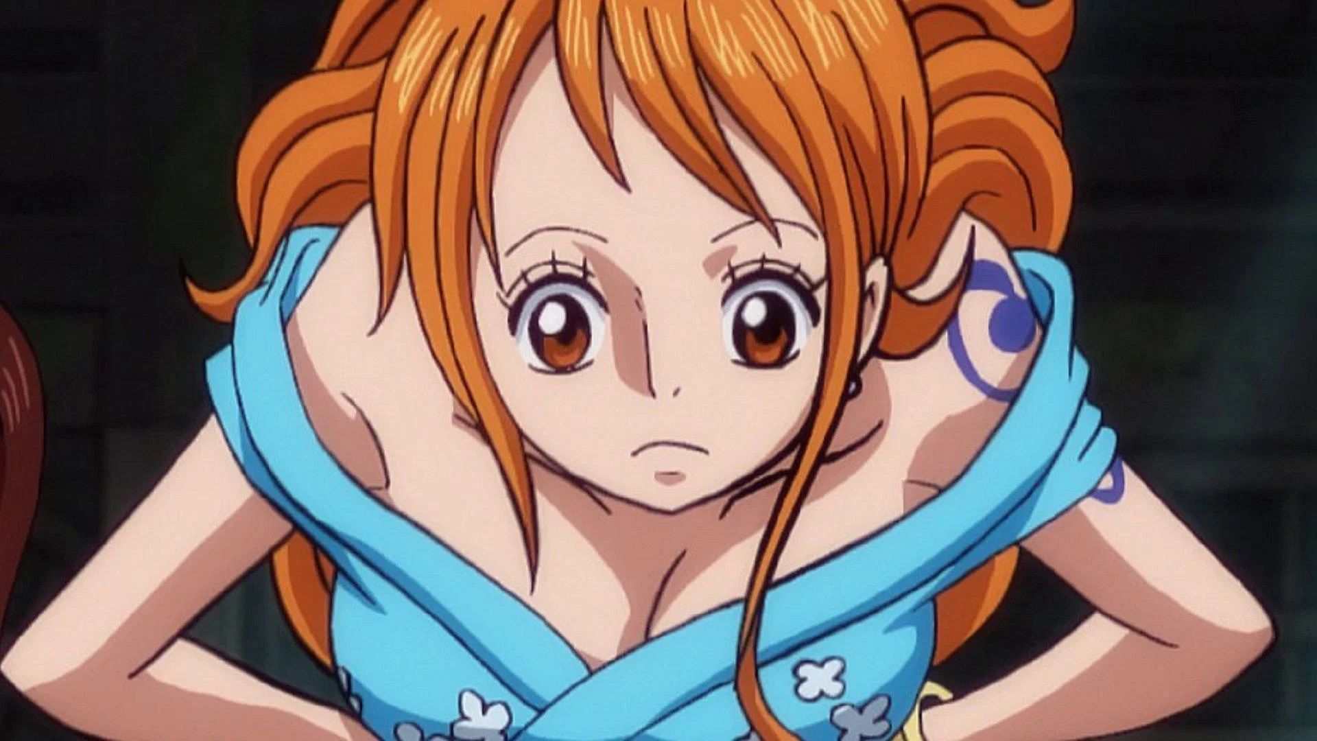 Nami has her hands on her hips while wearing a blue robe