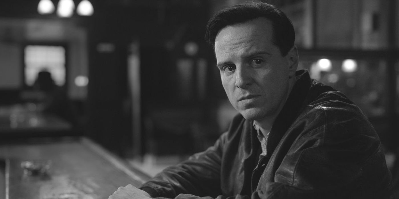 Tom Ripley (actor Andrew Scott) sits at a bar in a leather jacket in Netflix's Ripley.