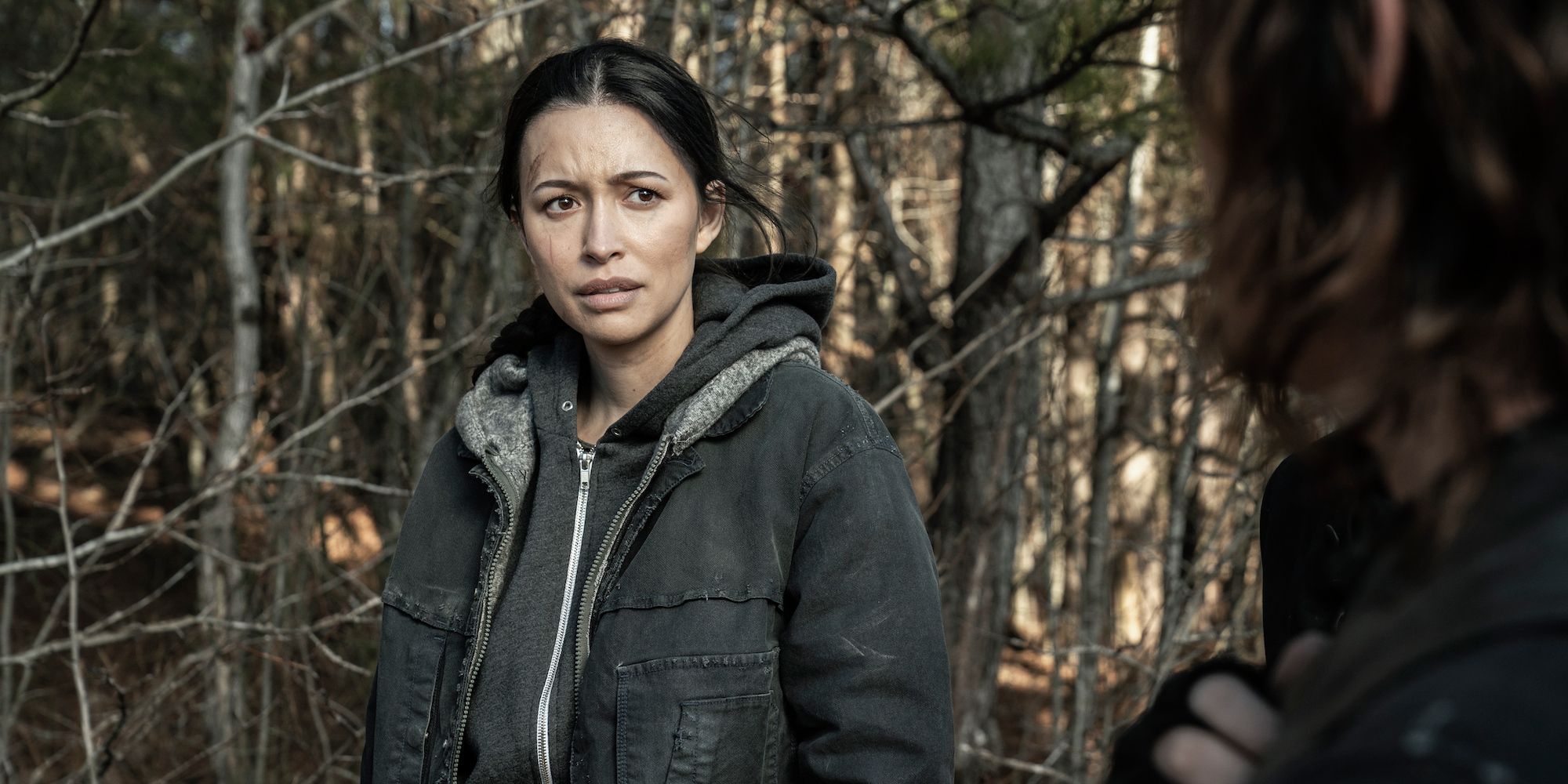 Rosita Espinosa wearing a heavy coat and angerly talking to Daryl Dixon in Season 11 of The Walking Dead.