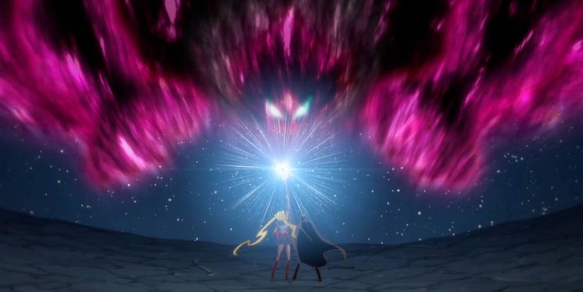 Sailor Moon and Tuxedo Mask fighting Chaos in the anime Sailor Moon Crystal.