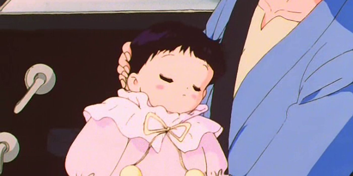 Sailor Saturn aka Hotaru Tomoe in her newborn baby form being held in a car in Sailor Moon.