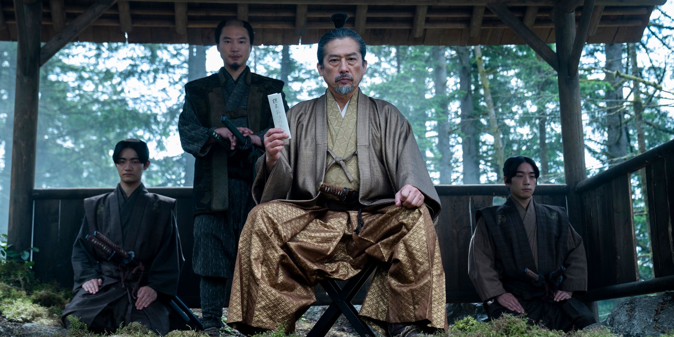 Lord Toranaga takes a scroll from Omi in Shogun