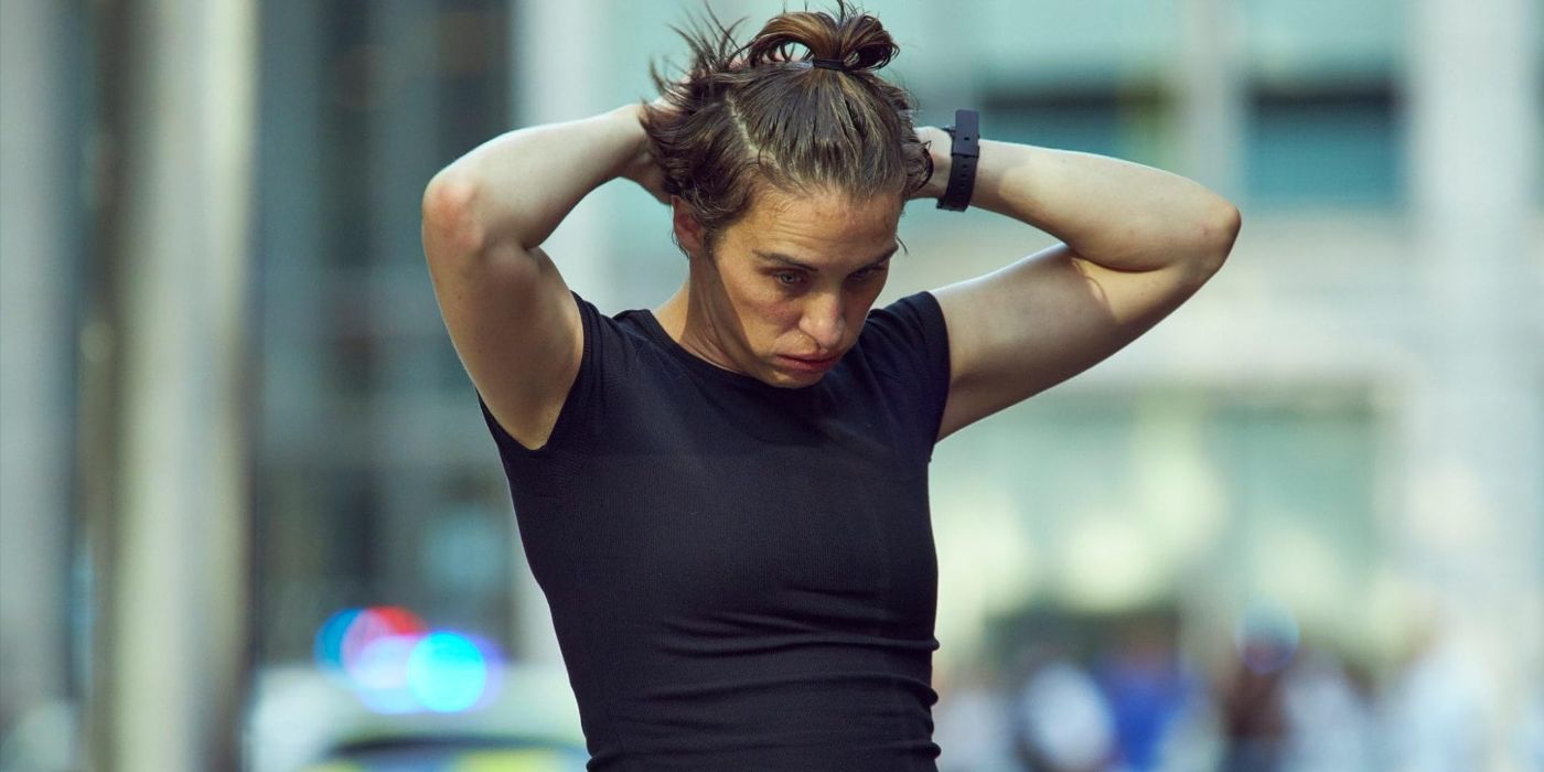 Lana (actor Vicky McClure) in a black T-shirt with hands on her head in Trigger Point