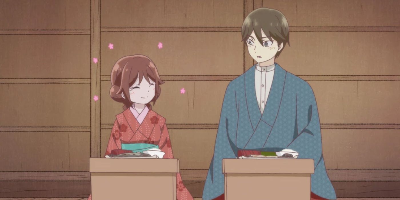 Yuzuki and Tamahiko sitting down to a meal together as Yuzuki smiles proudly in Taisho Otome Fairy Tale.