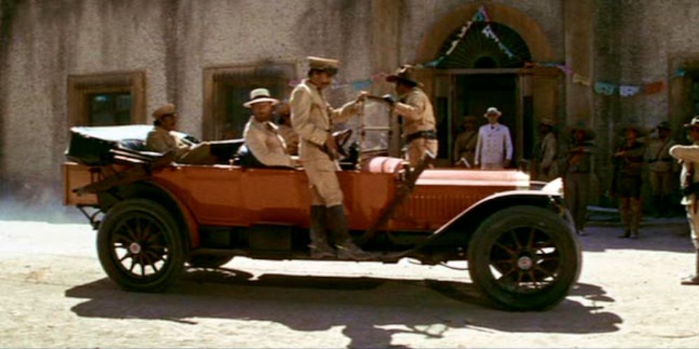 Car rides into town in The Wild Bunch