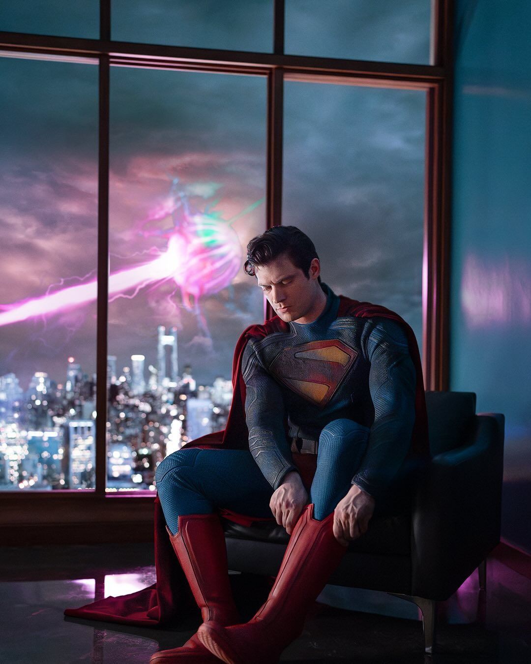 David Corenswet's Clark Kent/Superman putting on his boots in a still from the 2025 DCU movie.