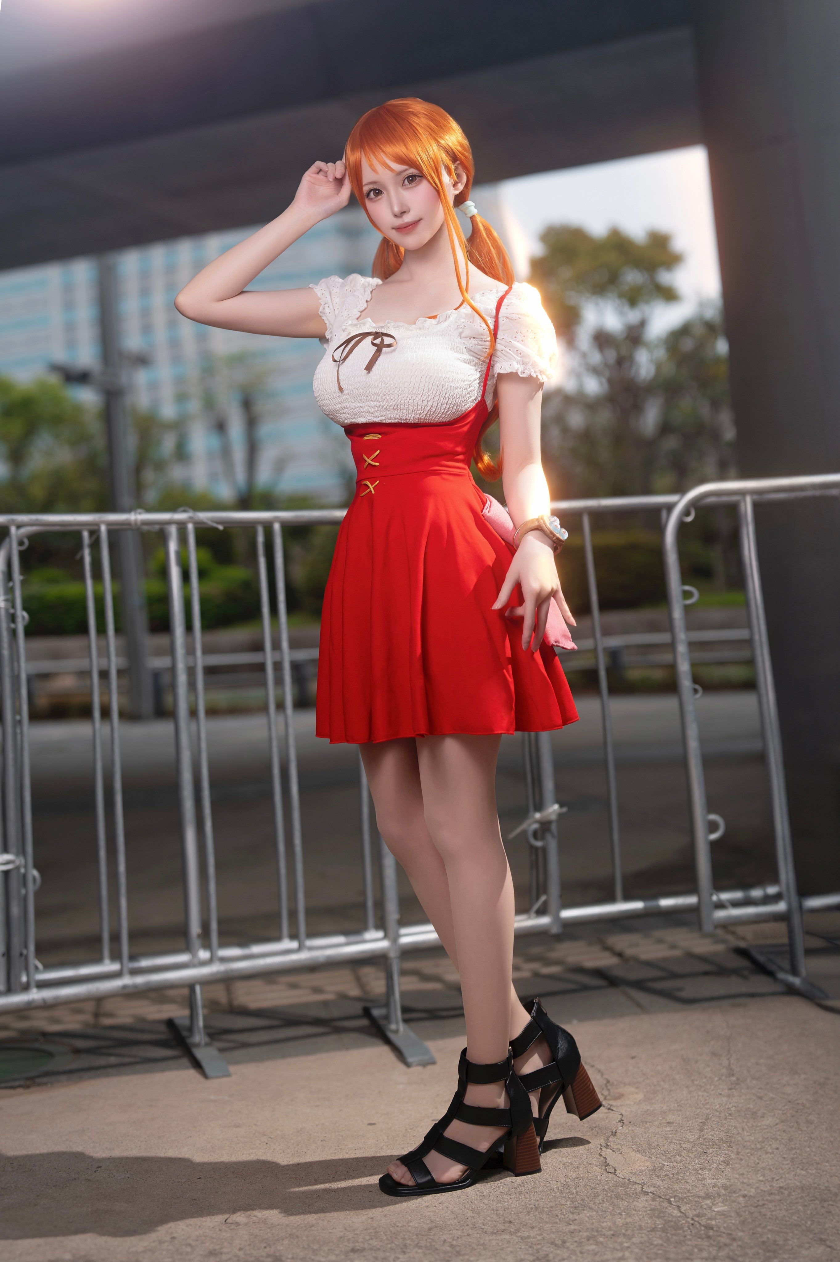 Full body shot of Nami One Piece anime cosplayer from Whole Cake Island arc