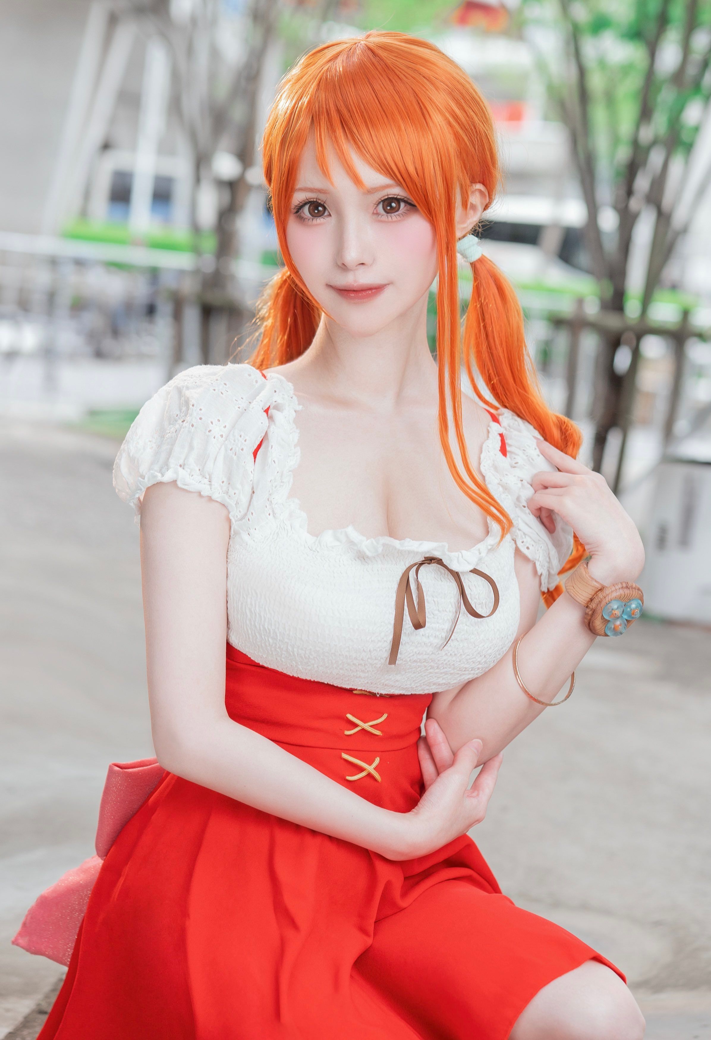 A 3/4 headshot of Nami One Piece anime cosplayer from Whole Cake Island arc