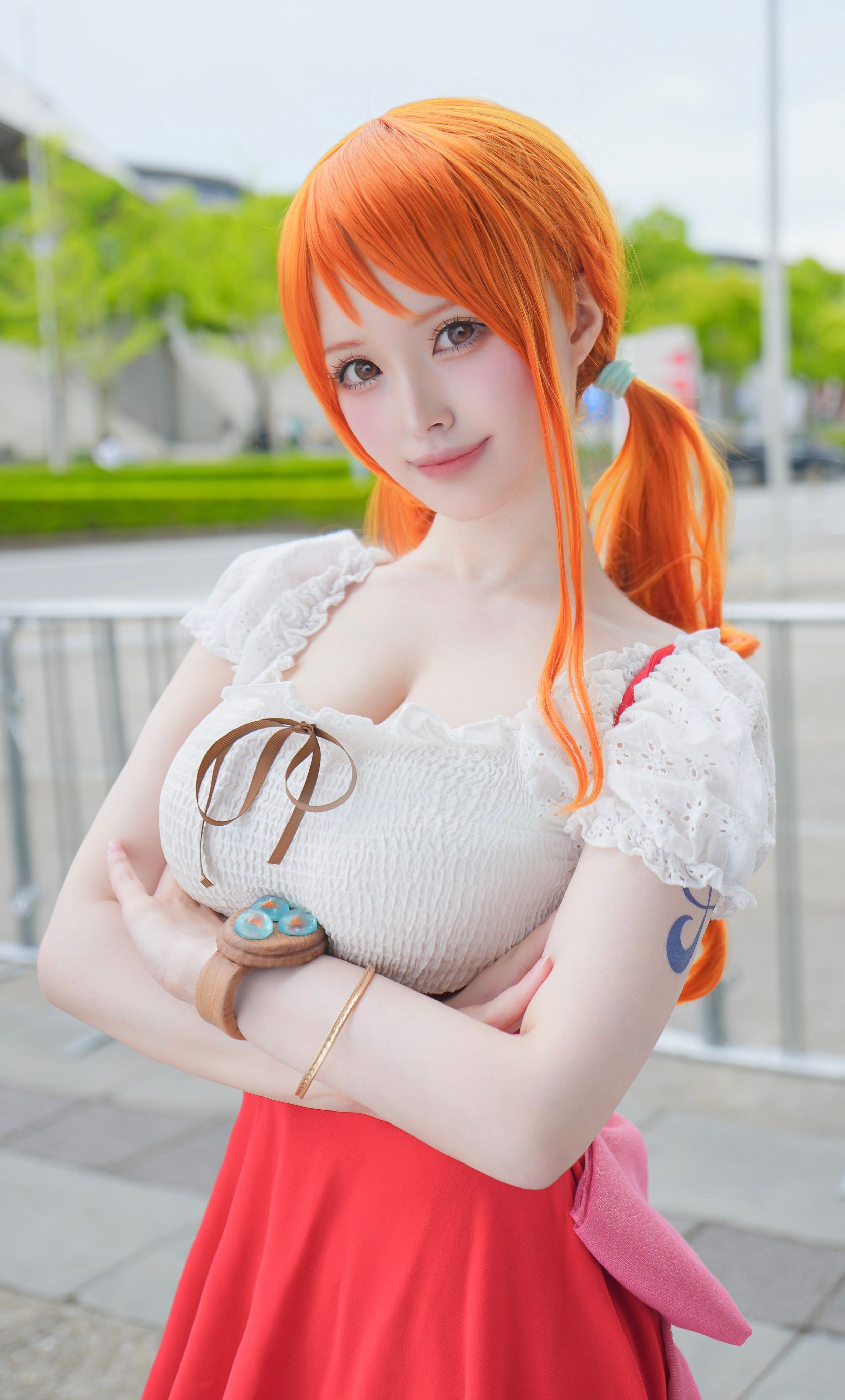 1/2 headshot of Nami One Piece anime cosplayer from Whole Cake Island arc