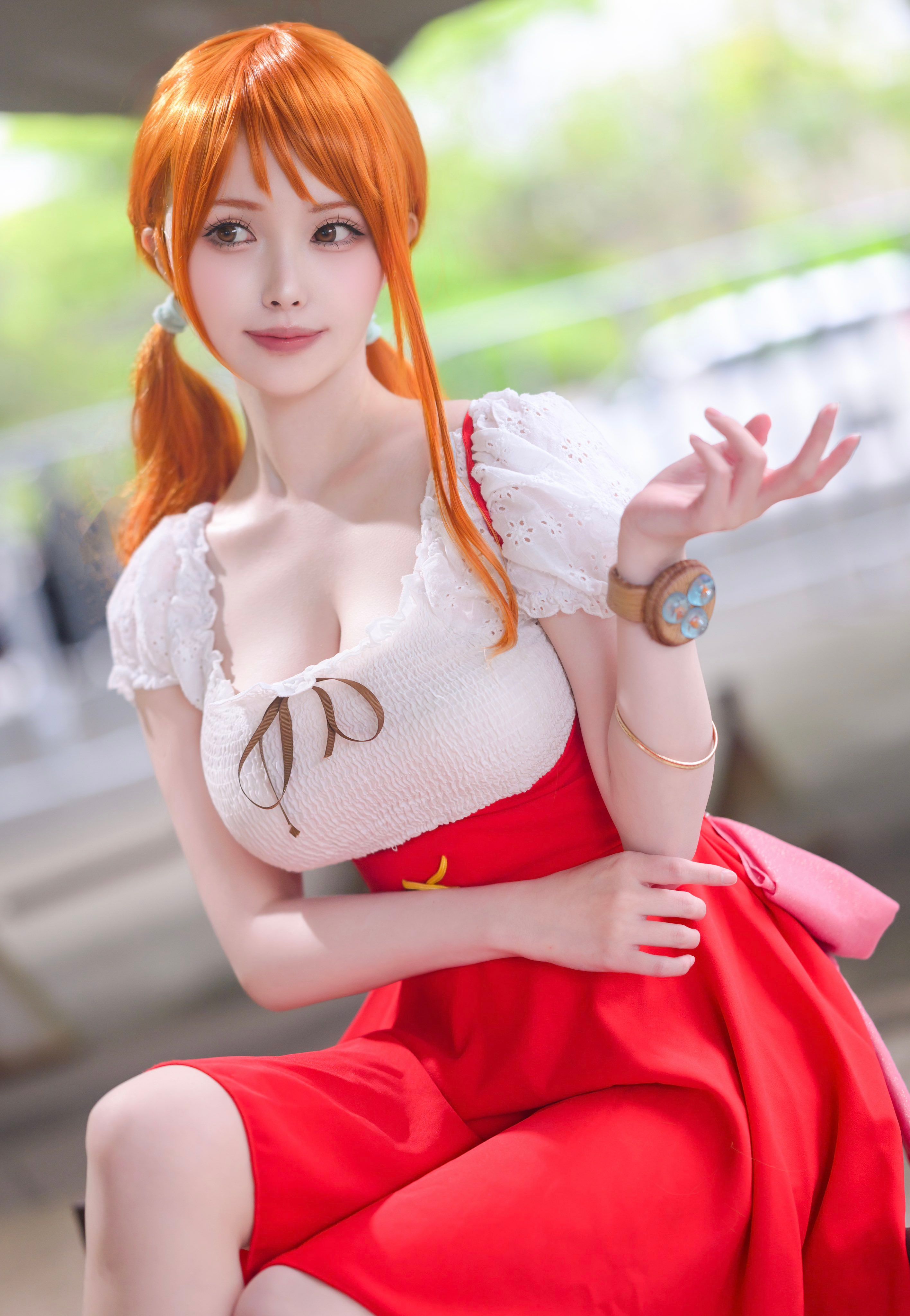 3/4 headshot of Nami One Piece anime cosplayer from Whole Cake Island arc