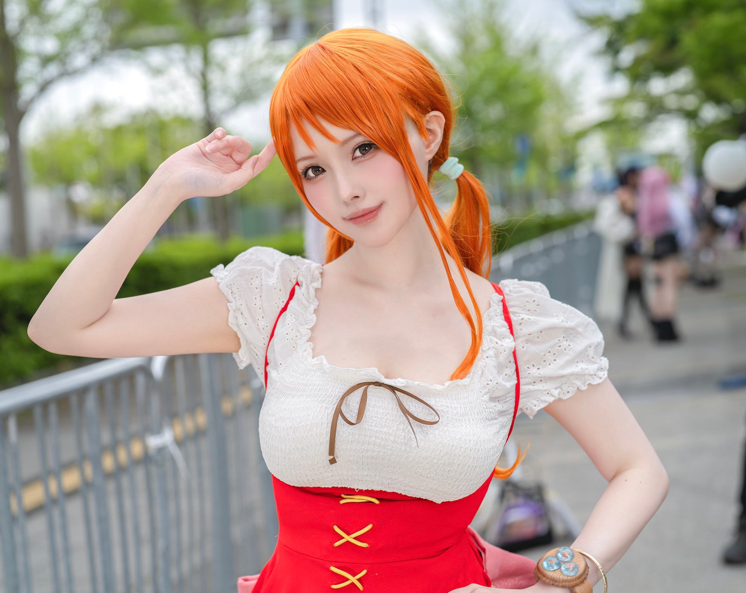 The image depicts an up-close view of Nami One Piece anime cosplayer from the Whole Cake Island Arc.