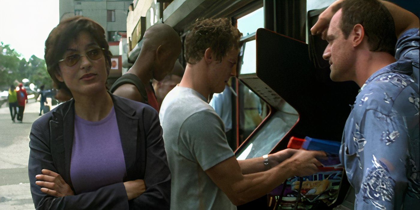 Detective Elliot Stabler (Christopher Meloni) and Detective Olivia Benson (Mariska Hargitay) interviewing a witness at an arcade in Law and Order: SVU episode "Wrong is Right"