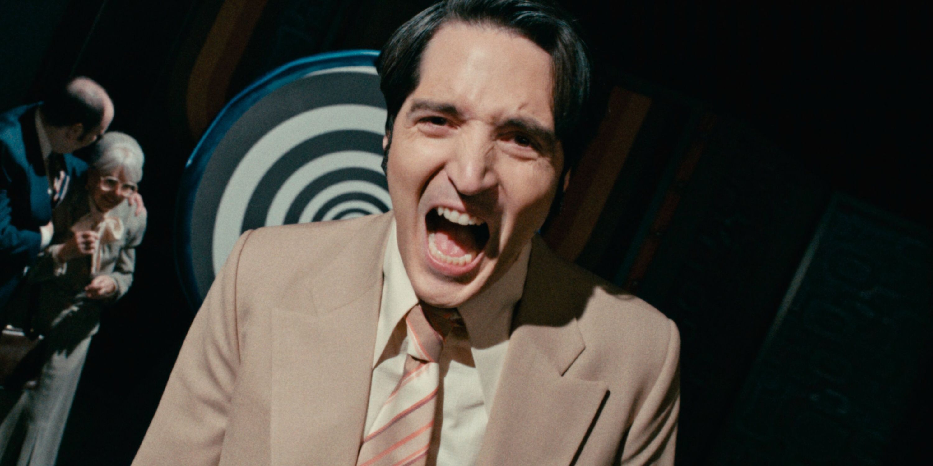 David Dastmalchian laughs as Jack Delroy, the television host featured in Late Night with the Devil