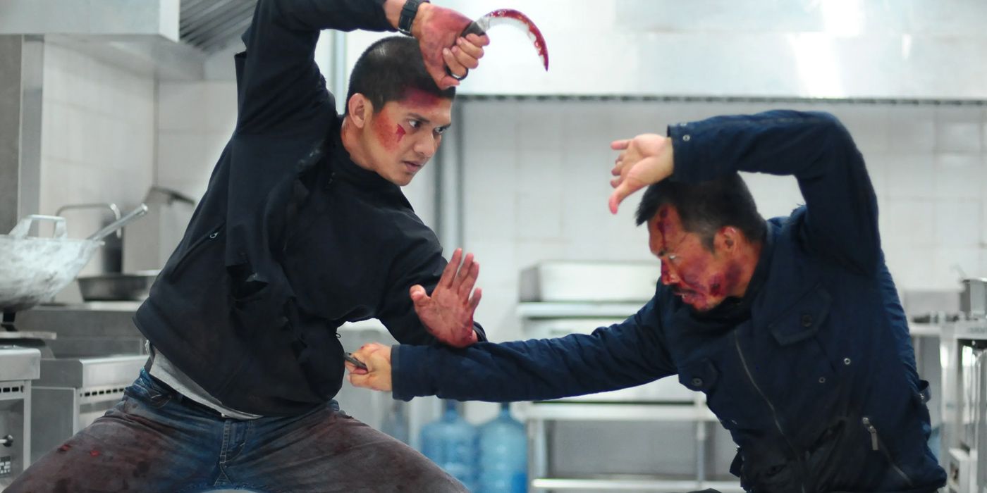 Rama and The Assassin lock hands during their fight in The Raid 2 Berandal
