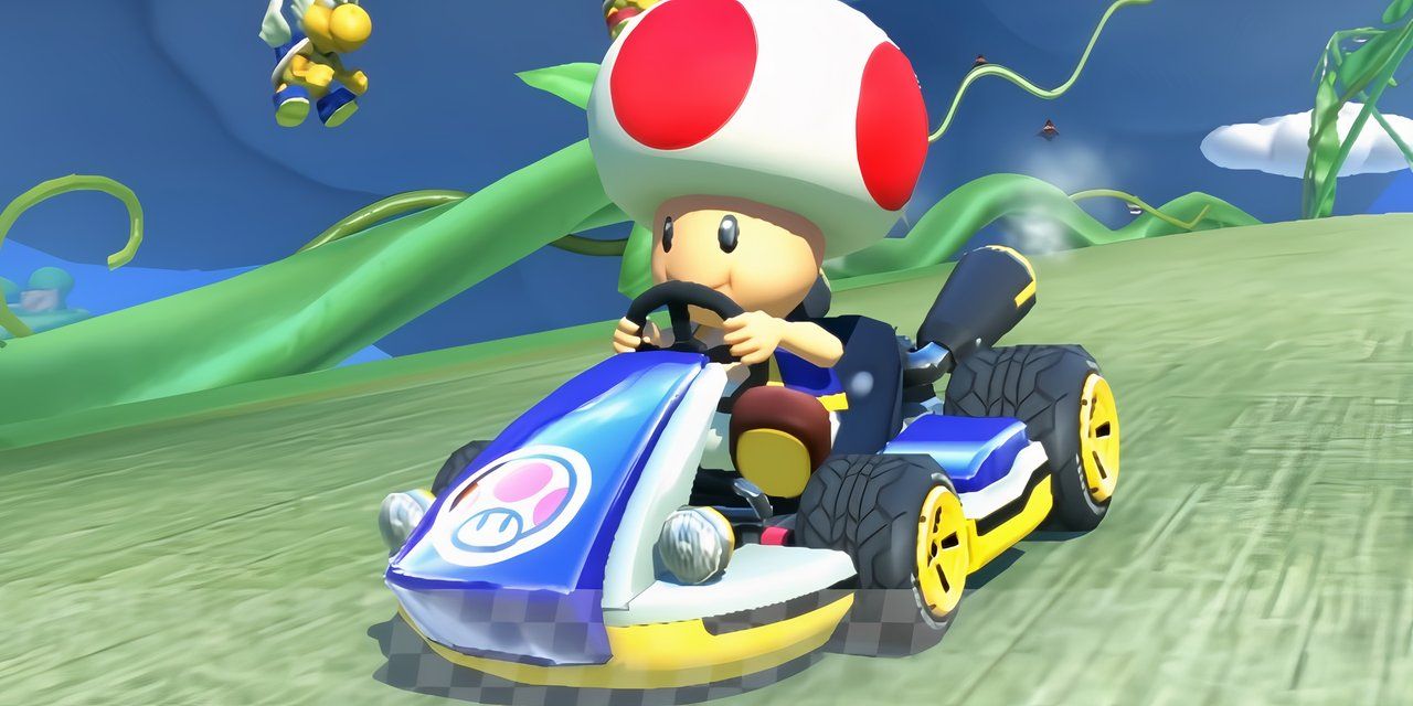 Sapo dirigindo em uma pista em Mario Kart