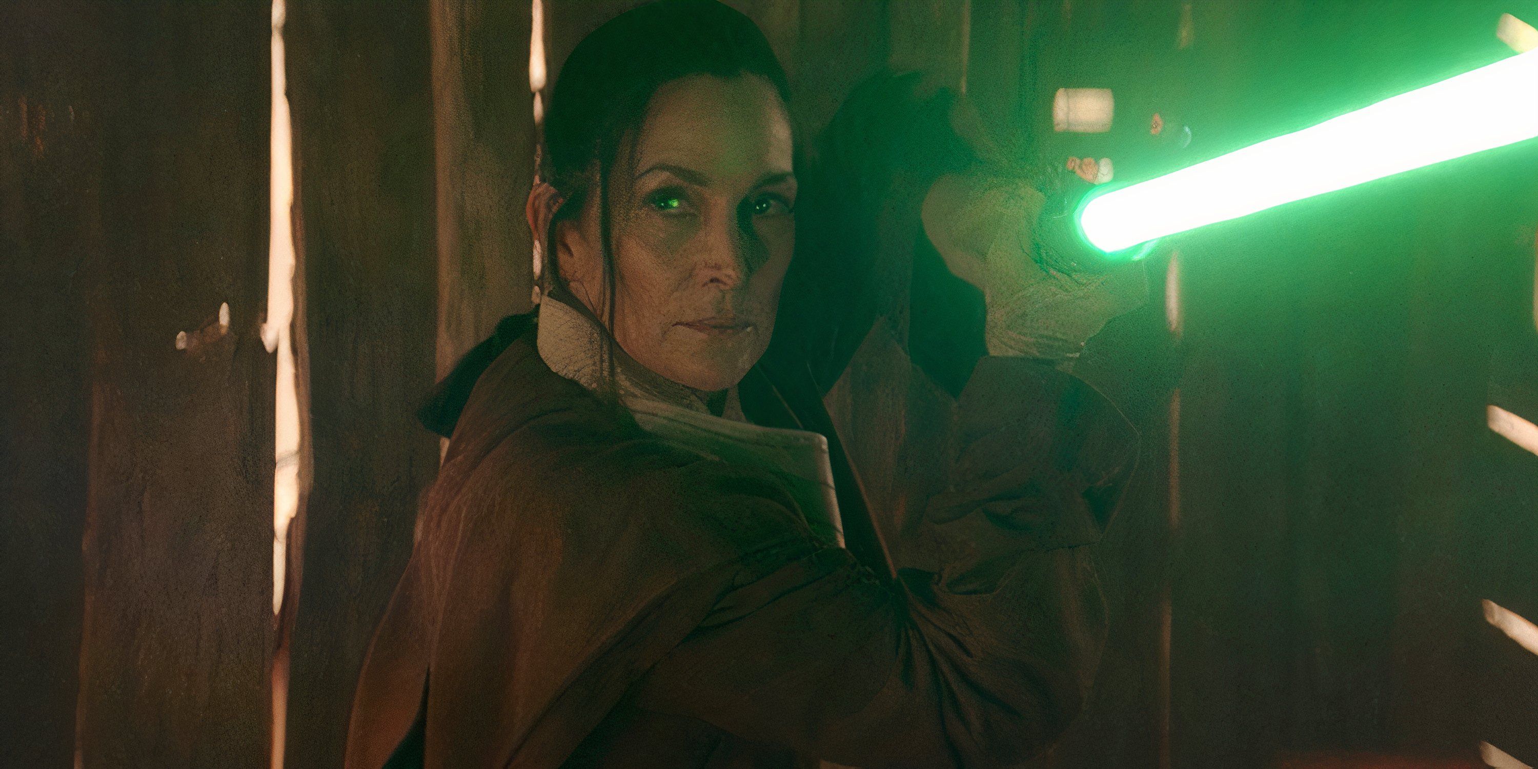 Master Indara (Carrie Anne-Moss) wields a green lightsaber in The Acolyte