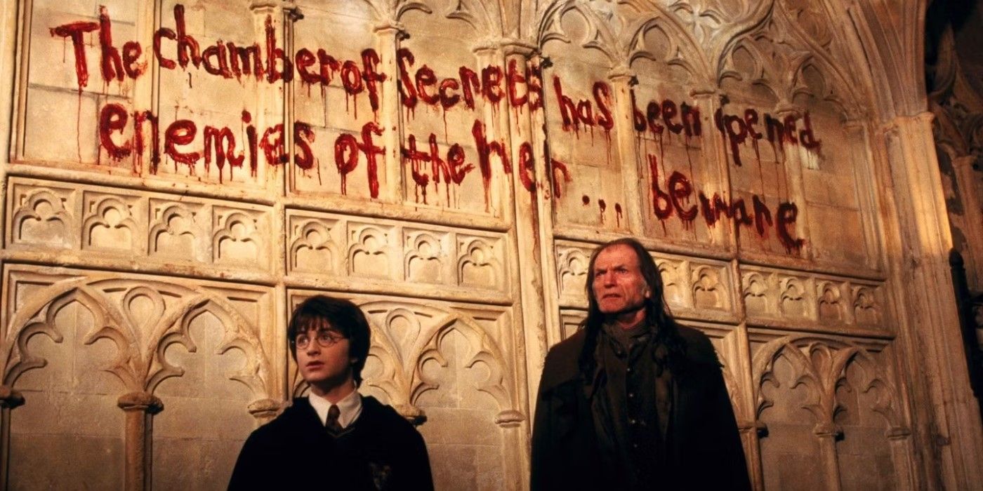 Harry Potter (actor Daniel Radcliffe) and Filch in Harry Potter and the Chamber of Secrets