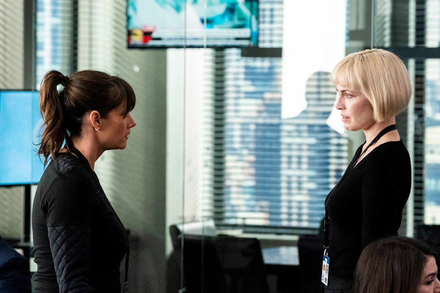 Maggie (actor Missy Peregrym) stands opposite Jessica (Charlotte Sullivan) in FBI