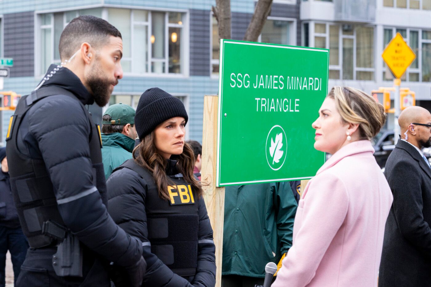 OA (actor Zeeko Zaki) and Maggie (Missy Peregrym) speak to a politician in a pink coat on FBI