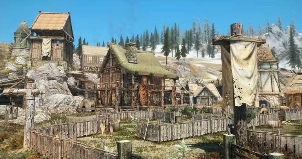 fazenda de madeira perto de uma montanha nevada em Skyrim 