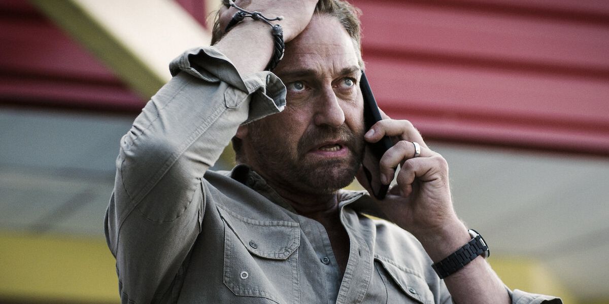 Gerard Butler looks annoyed on the phone in 
