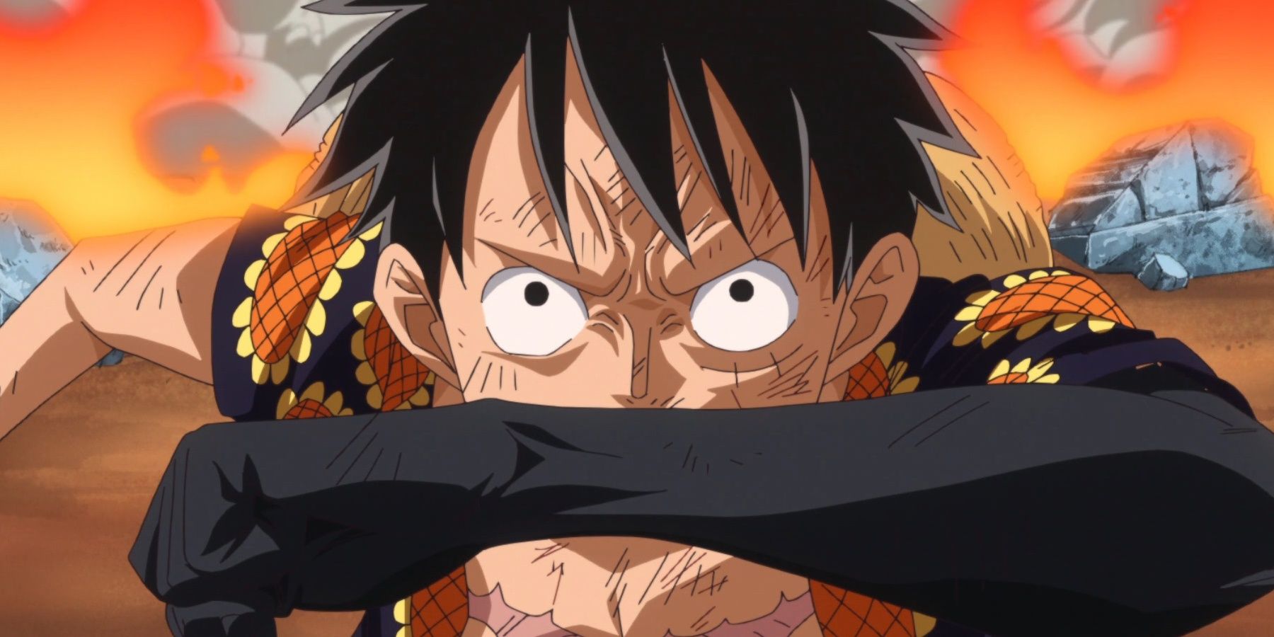 Luffy holds up his arm while using color of arms haki