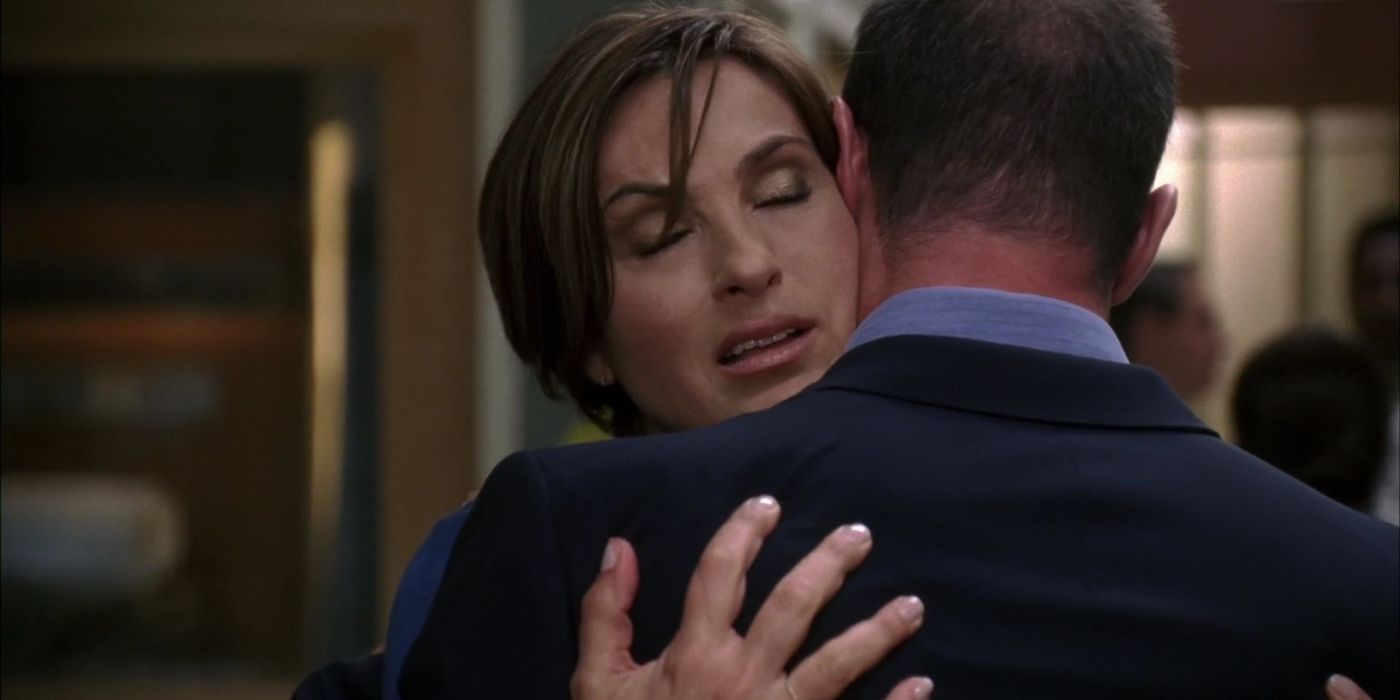 Mariska Hargitay as Olivia Benson closes her eyes and hugs Christopher Meloni as Elliot Stabler on Law & Order_ SVU