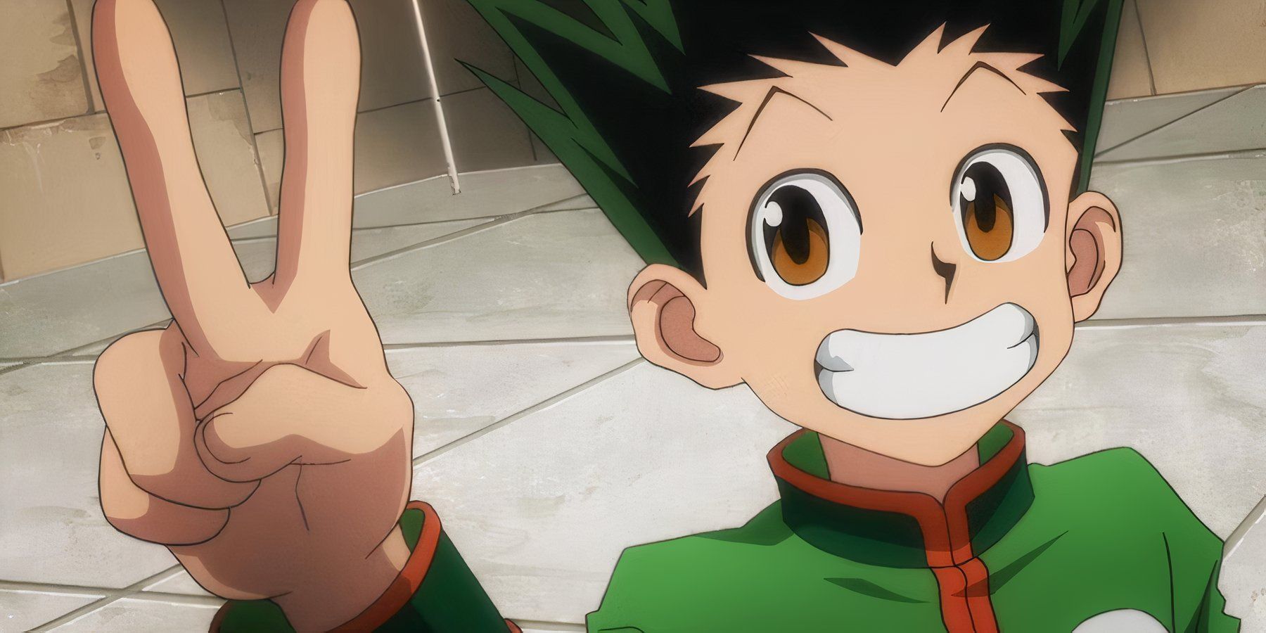 Gon Freecss smiles after winning a fight during the Hunter Exam in Hunter X Hunter.