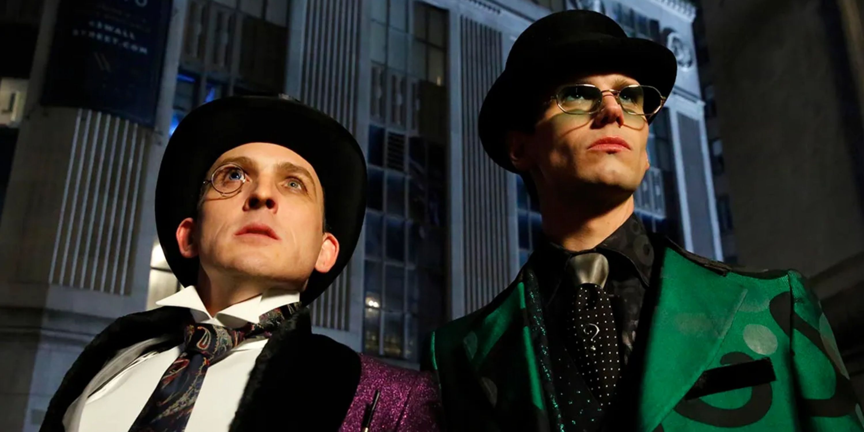 The Penguin and the Riddler watch worriedly in Gotham