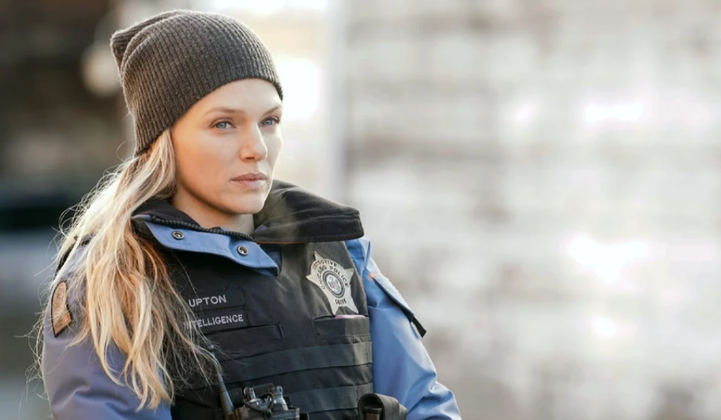 Hailey Upton in uniform stares contemplatively out of frame in Chicago P.D.