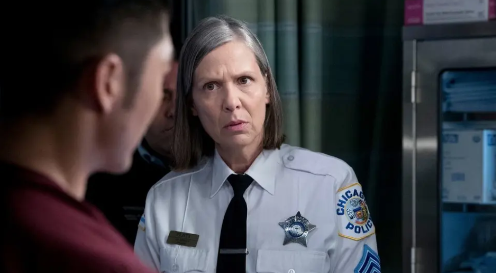 Trudy Platt looks concerned in uniform in an office on Chicago P.D.