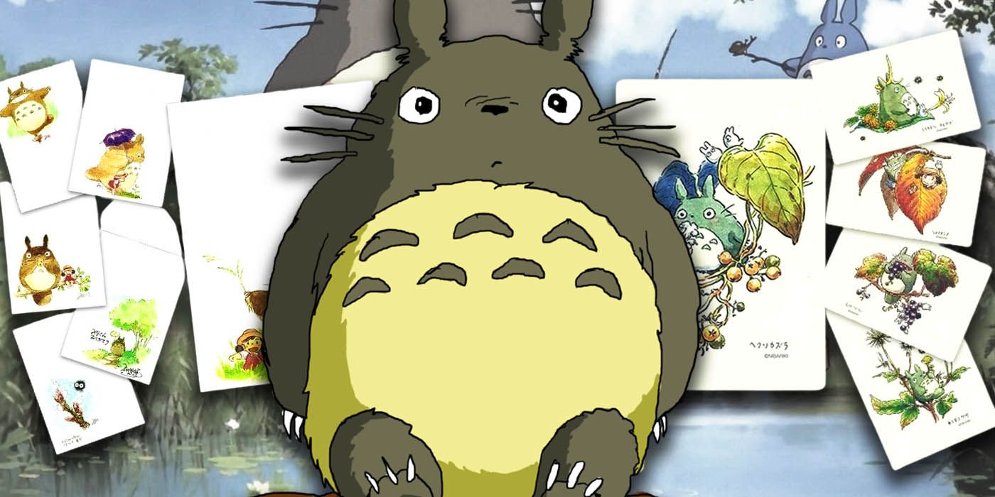 Ghibli's Totoro sitting in front of watercolor My Neighbor Totoro art by Hayao Miyazaki