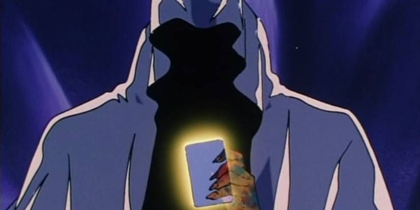 Wiseman holding a glowing card in the anime Sailor Moon.