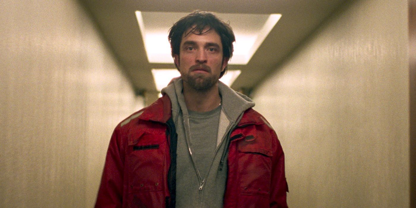 Robert Pattinson looks distressed as he walks down a hallway in Good Time.