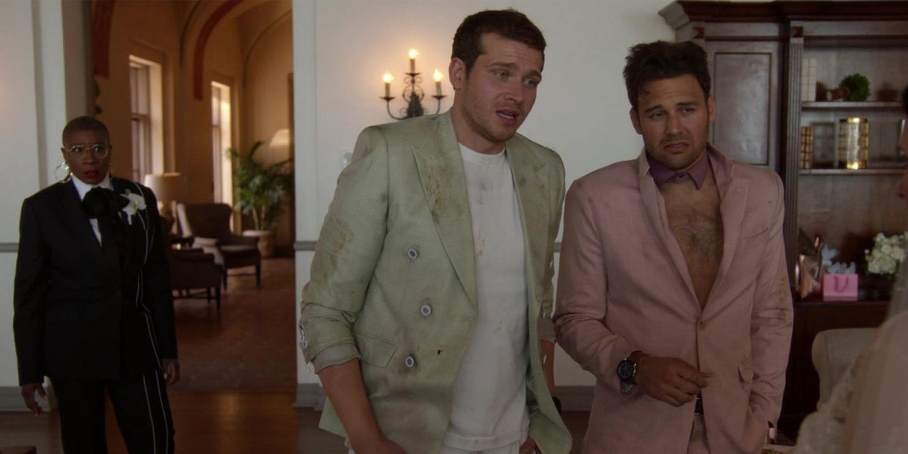 Eddie and Buck arrive at Maddie's wedding, hungover and disheveled, wearing wrinkled suits.