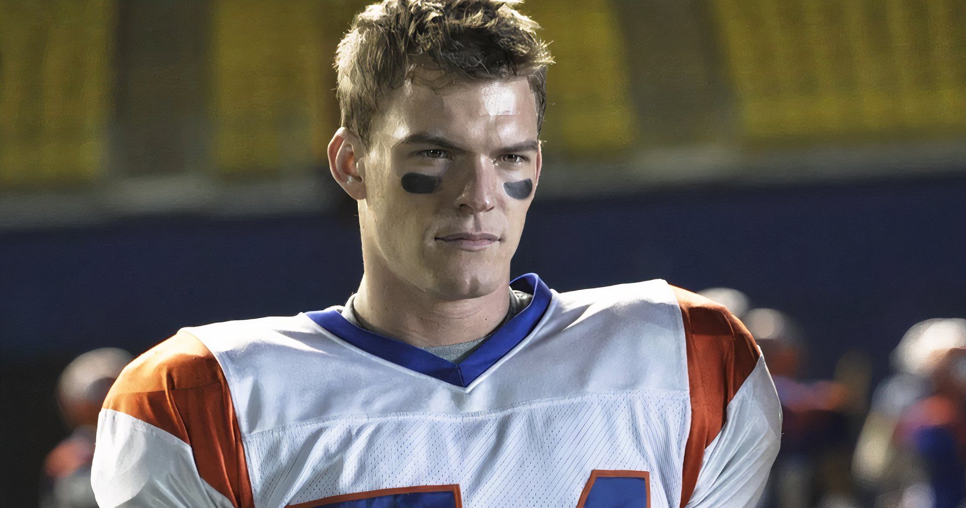 Thad Castle is wearing his football uniform in Blue Mountain State