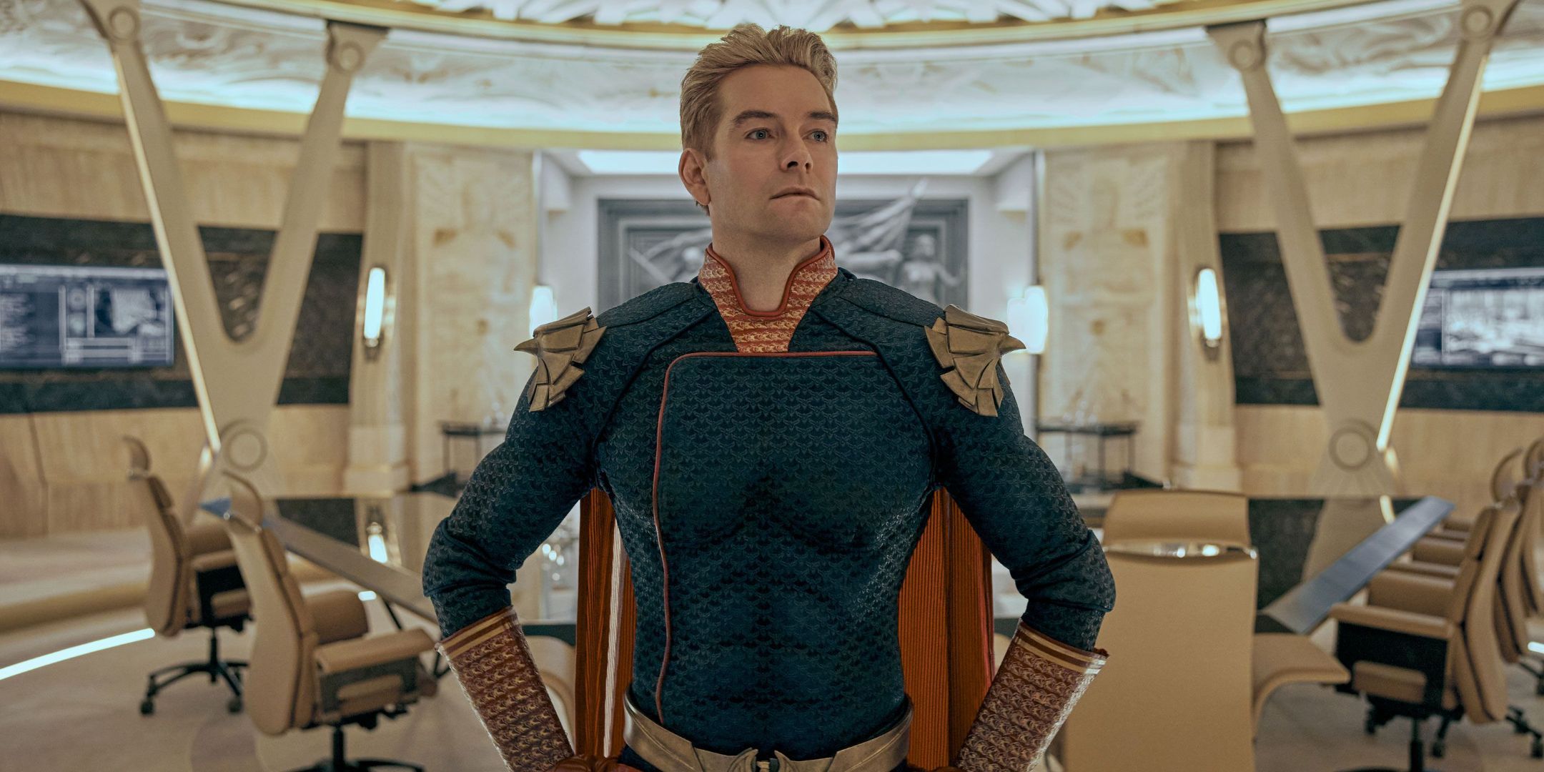 Antony Starr as Homelander poses with hands on hips in The Seven headquarters in The Boys