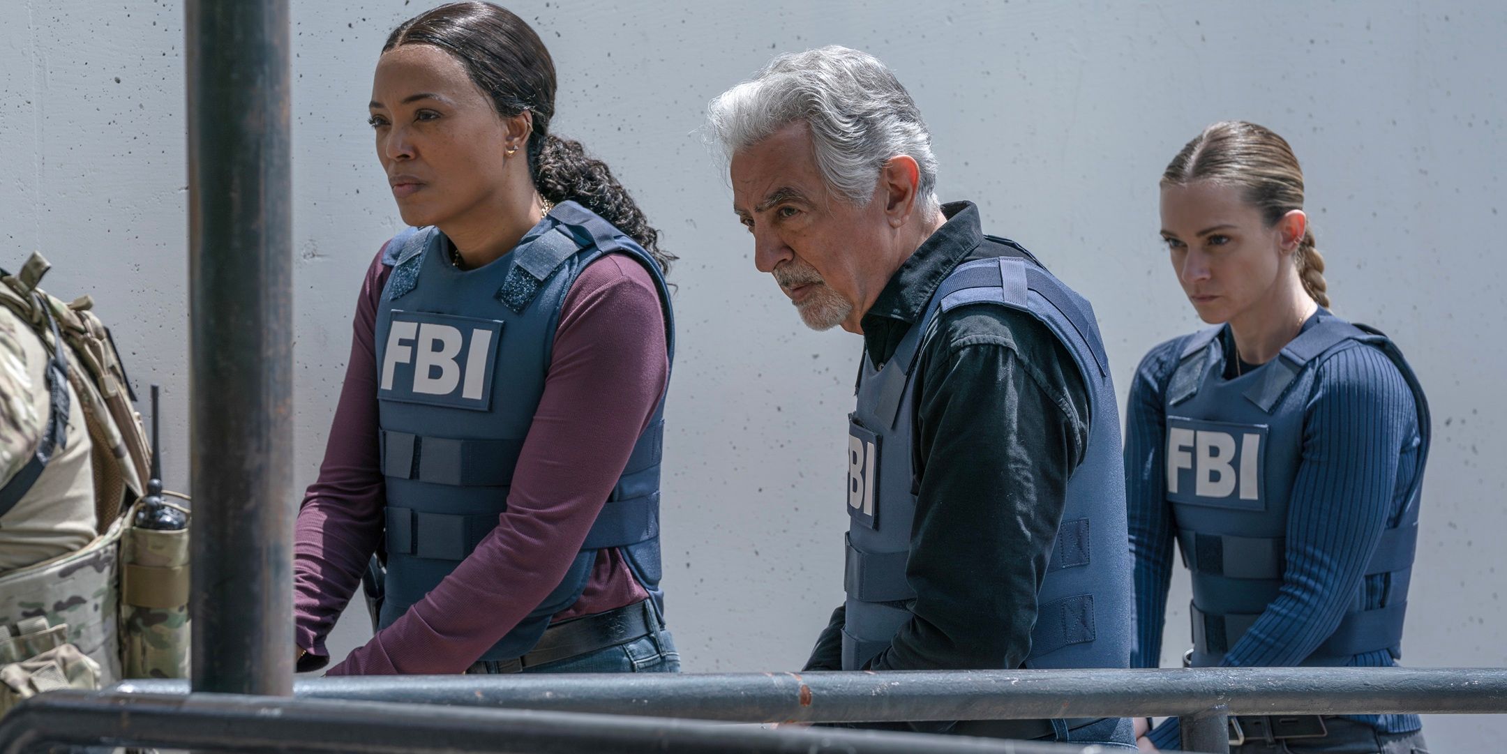 Tara, Rossi and JJ in FBI vests with their weapons drawn, looking ahead in Criminal Minds: Evolution