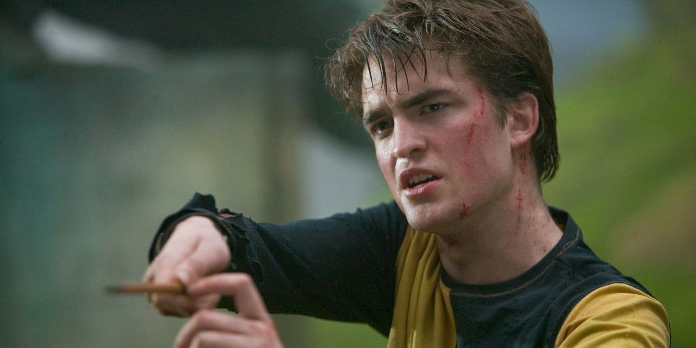 Cedric Diggory (actor Robert Pattinson) holds up a wand in Harry Potter and the Goblet of Fire.