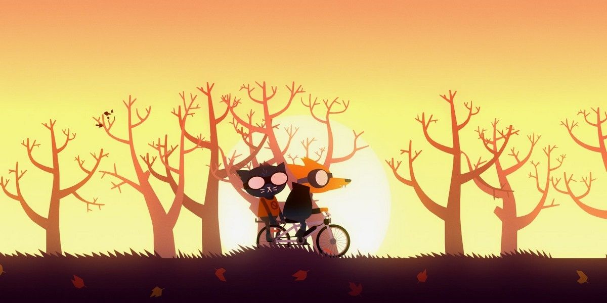 Mae and Gregg ride on a bike.