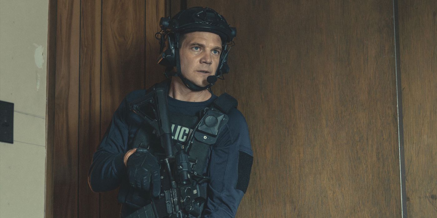 Kyle McLusky (actor Taylor Handley) stands in the doorway in police uniform in the third season of Mayor of Kingstown