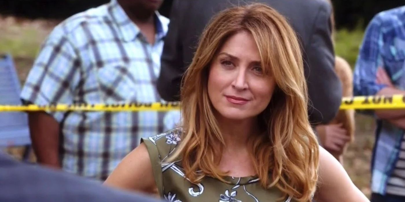 Maura Isles standing in front of police tape on Rizzoli & Isles