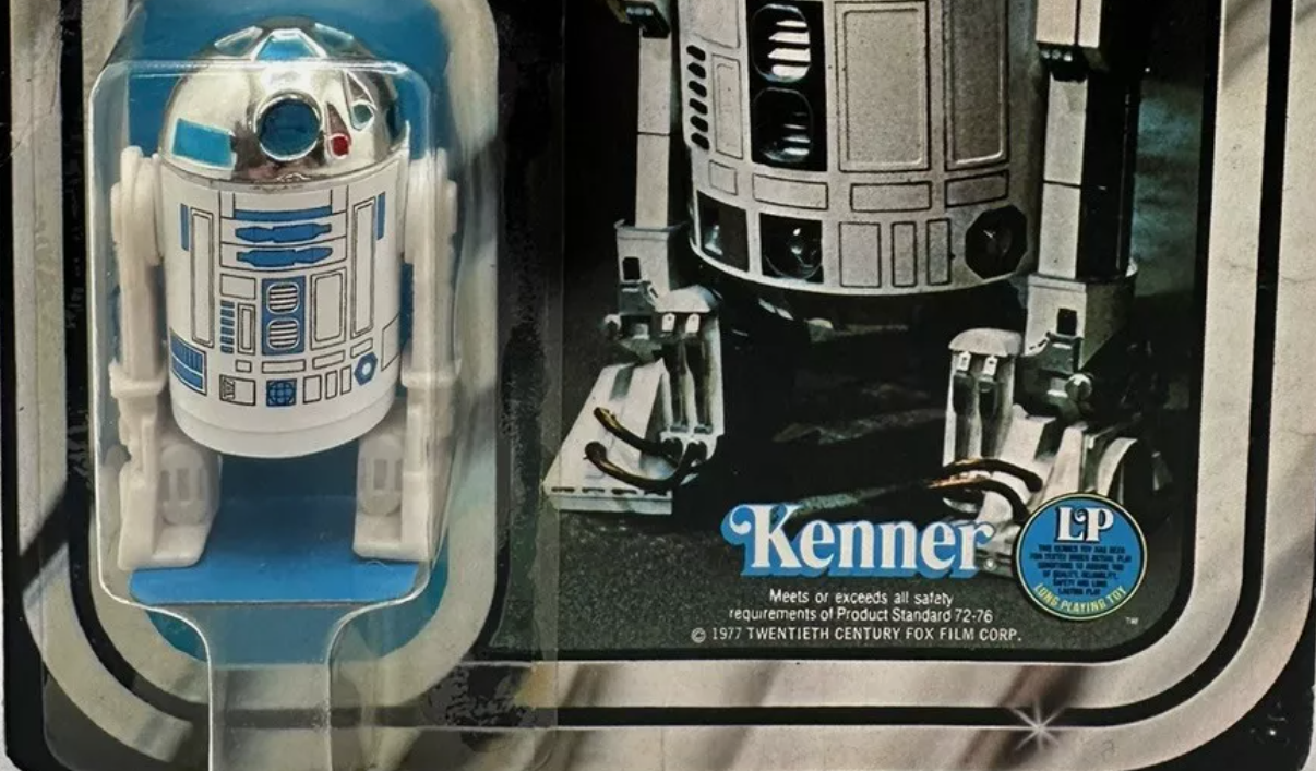 Close-up shows R2-D2 action figure in its Kenner packaging.