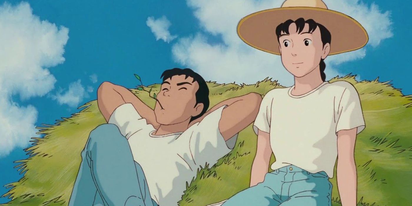 Toshio and Taeko sit on a pile of hay in Only Yesterday.